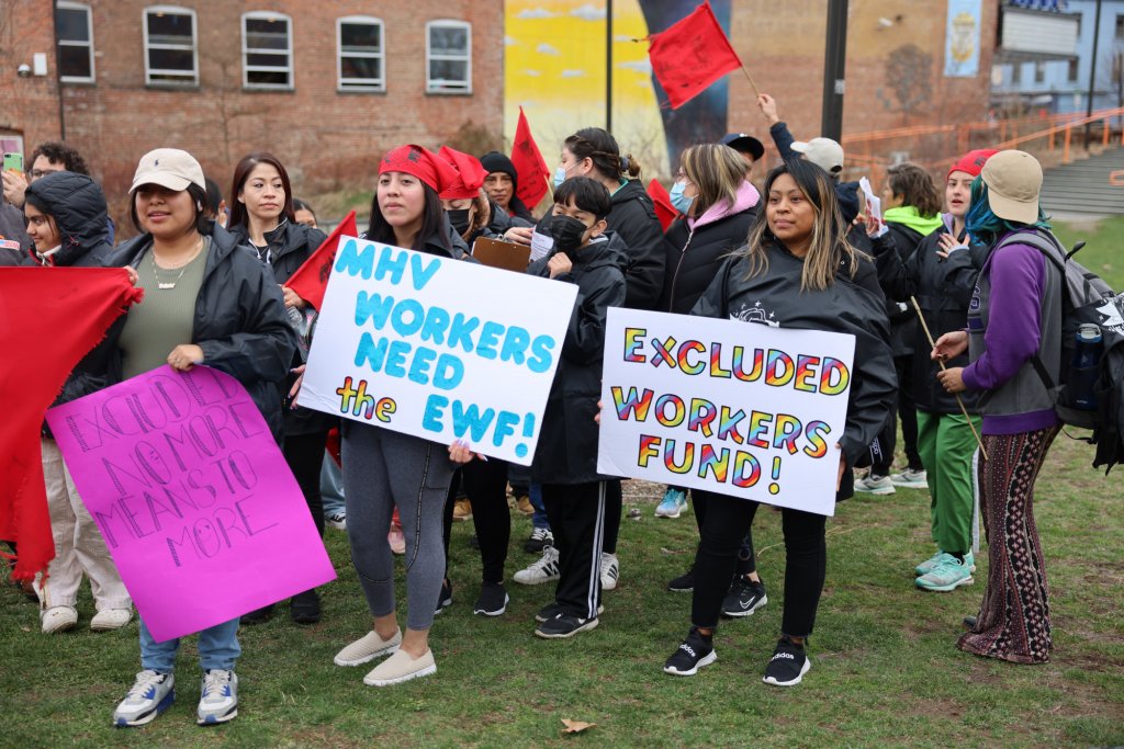 With signs at the FEW rally in March 2022
